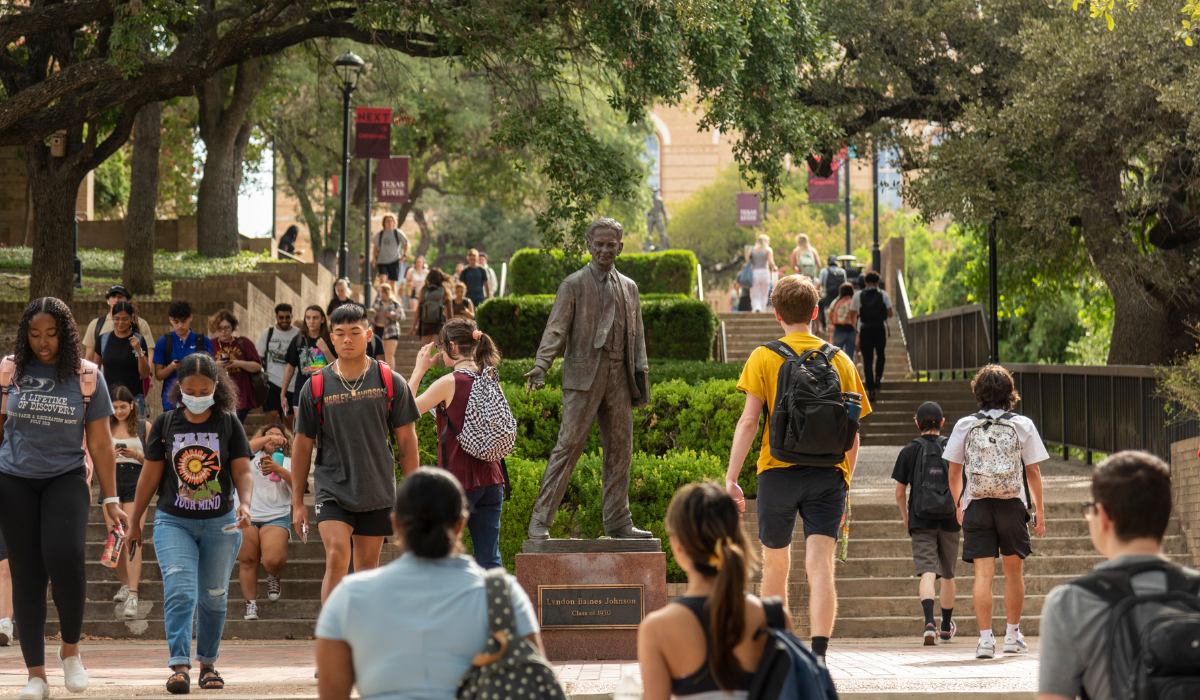 student walking in the quad at TXST