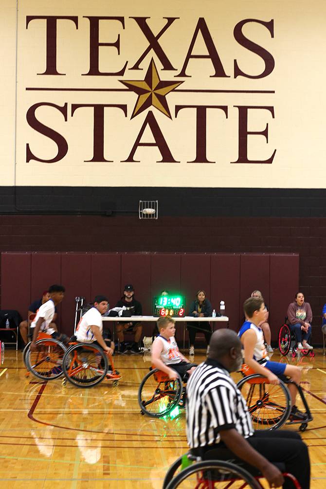 children in wheelchairs in texas state gym