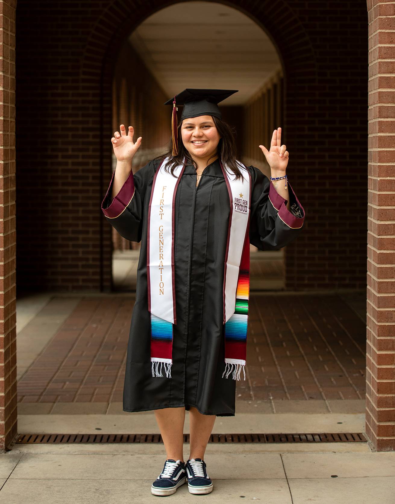 latina woman wearing graduation gown