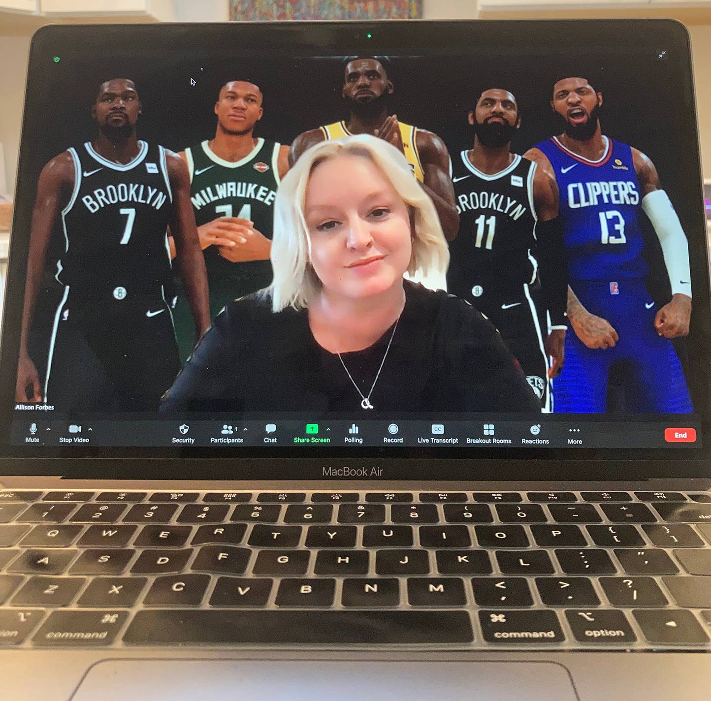 ali forbes on computer screen in front of nba2k players