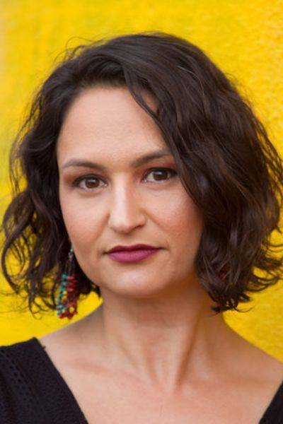 womans headshot in front of yellow background