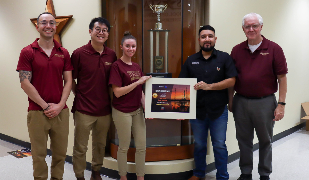 texas state students and faculty holding an award
