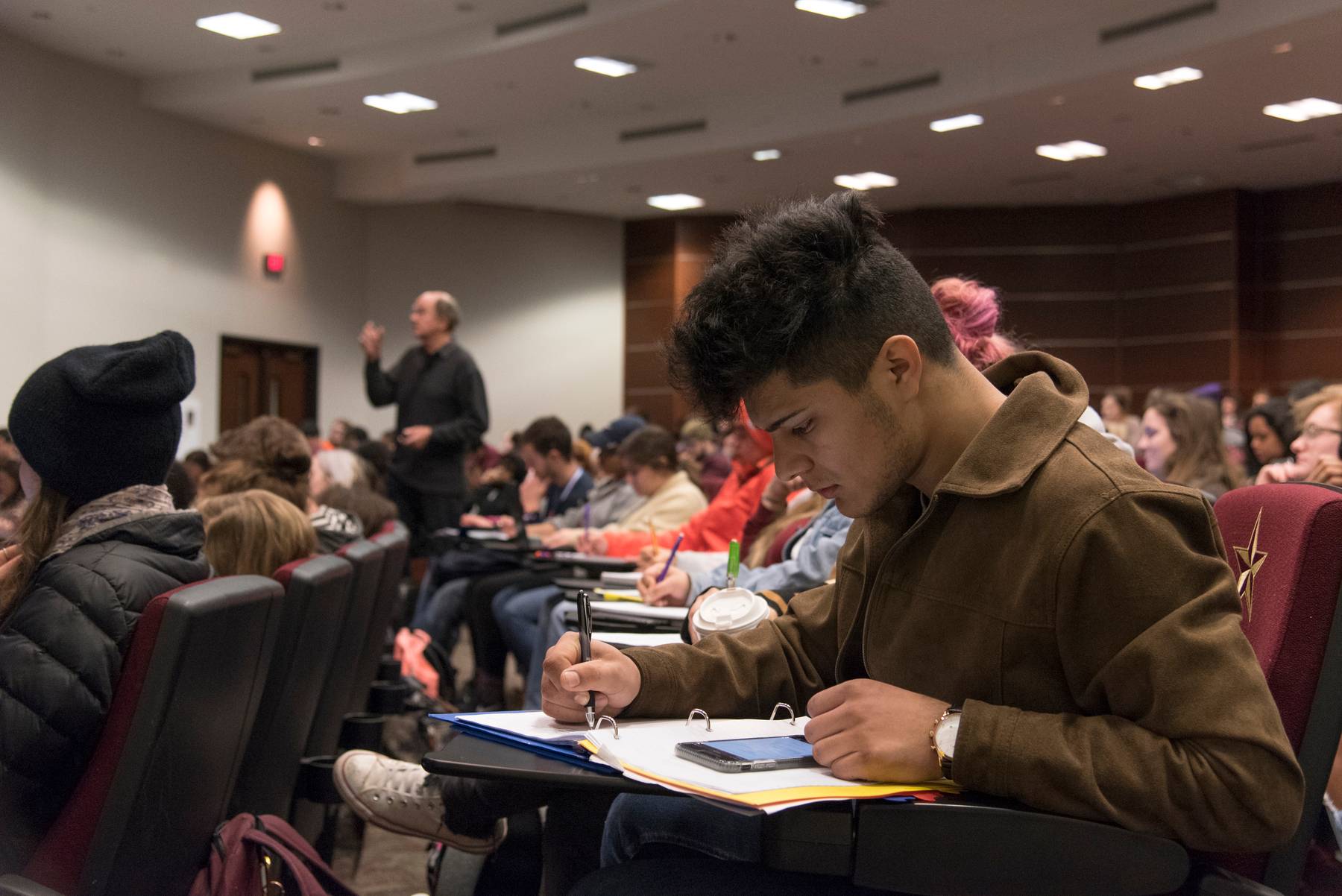 Student Writing in Class