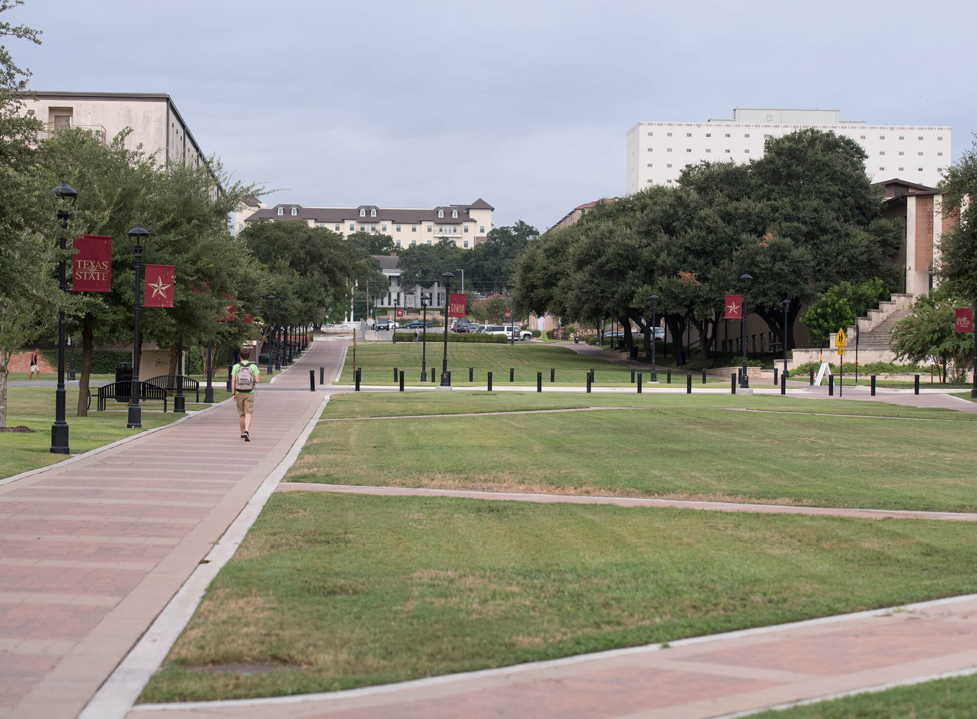 Student walking within the University mall