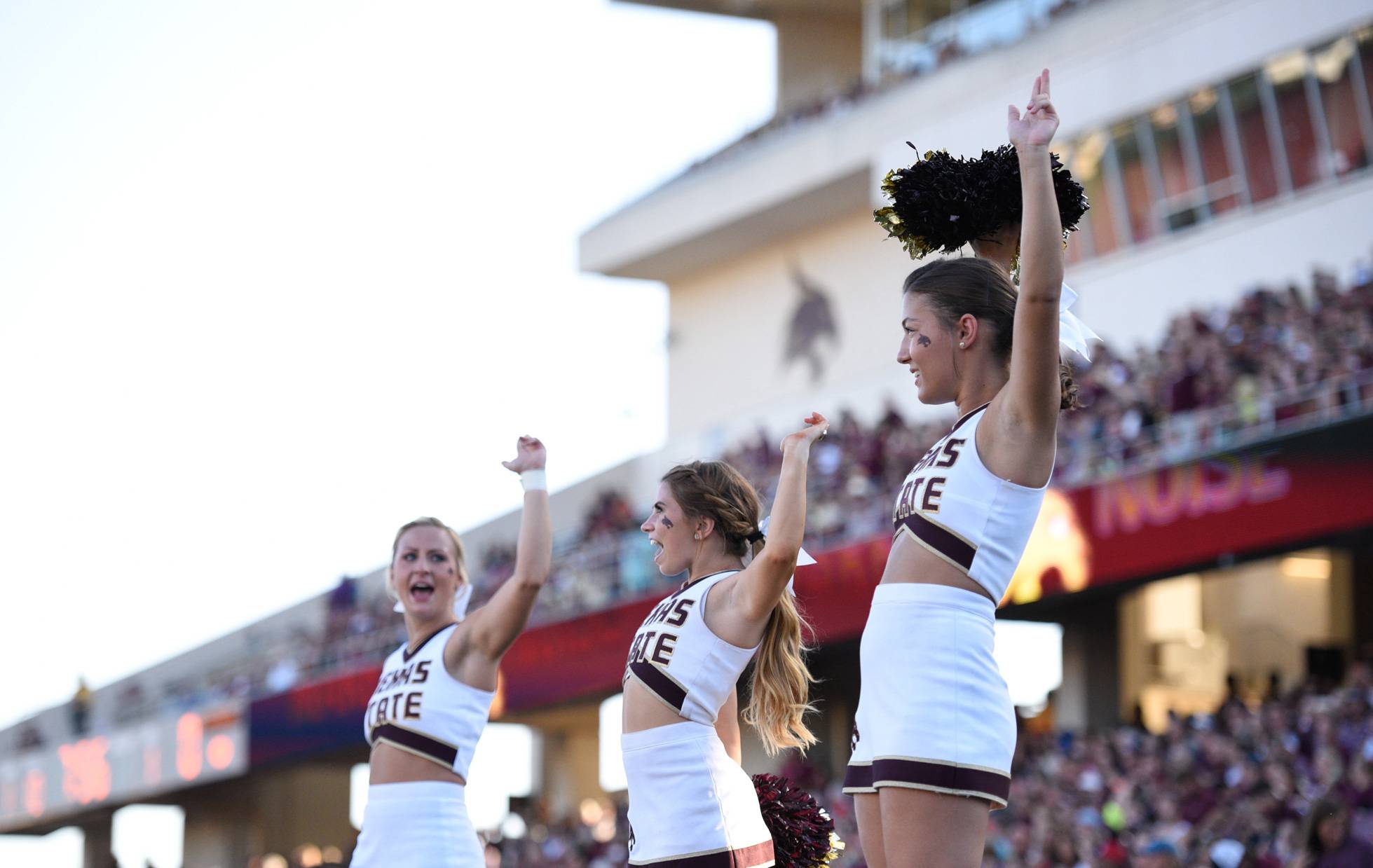Cheer leaders performing at a football game