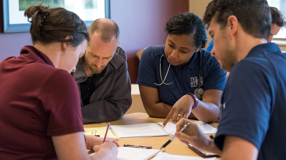 Nursing students work on an assignment together