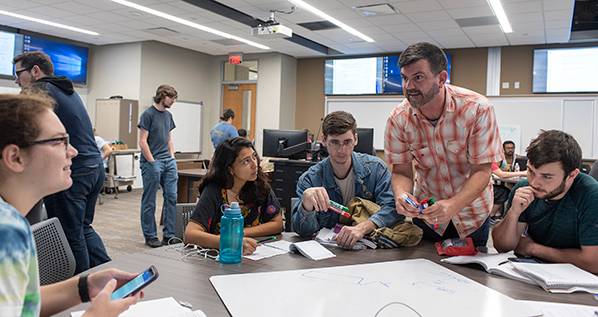 Faculty member and students in class at TXST