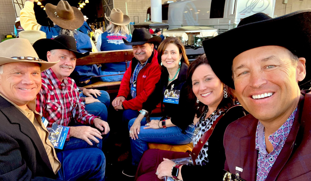 President Damphousse taking a selfie with wife and friends at the rodeo
