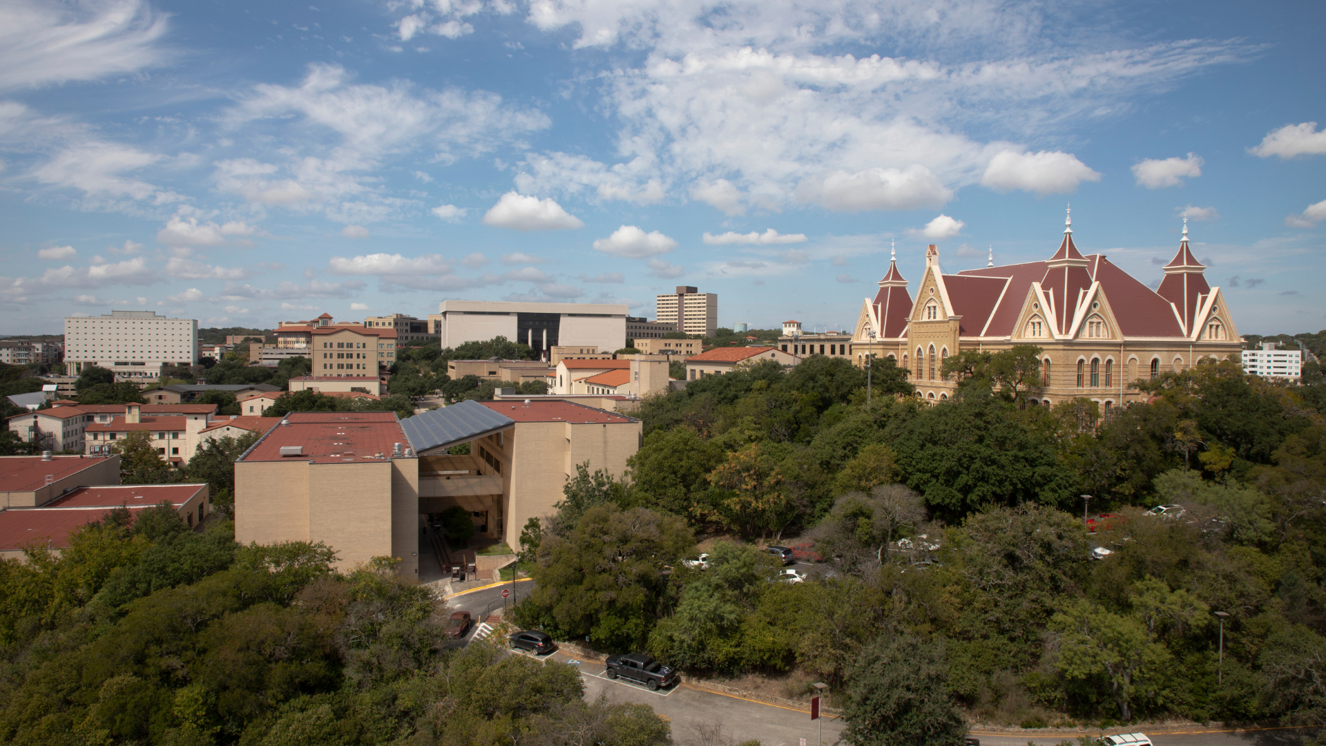 A campus shot featuring Old Main and other buildings on a beautiful sunny day.
