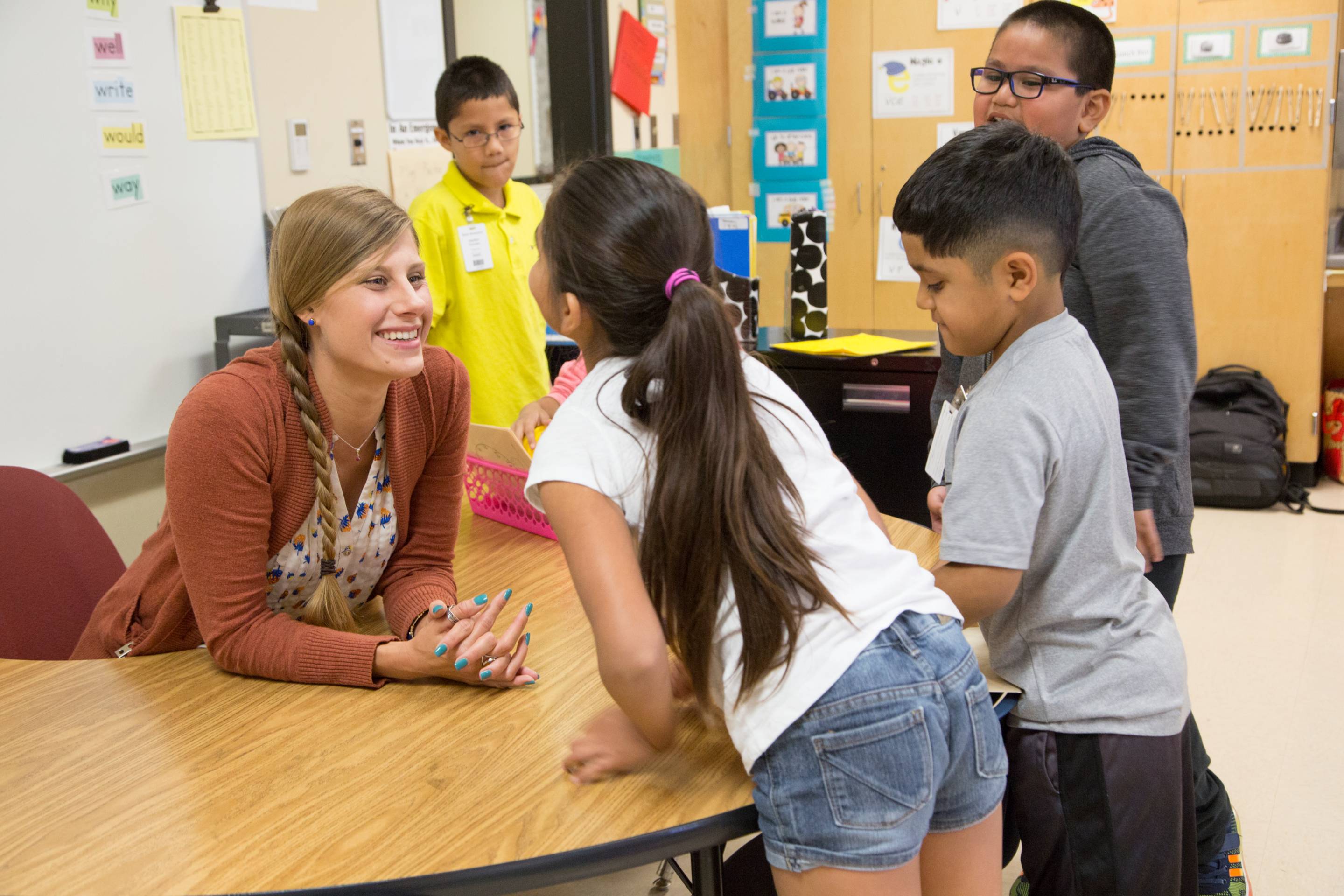 student teacher speaking with students