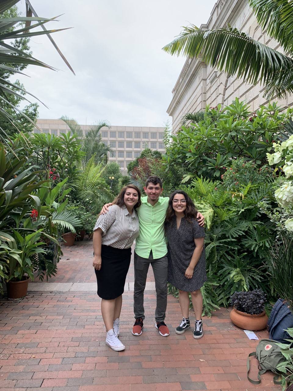 Three students in a beautiful botanical garden