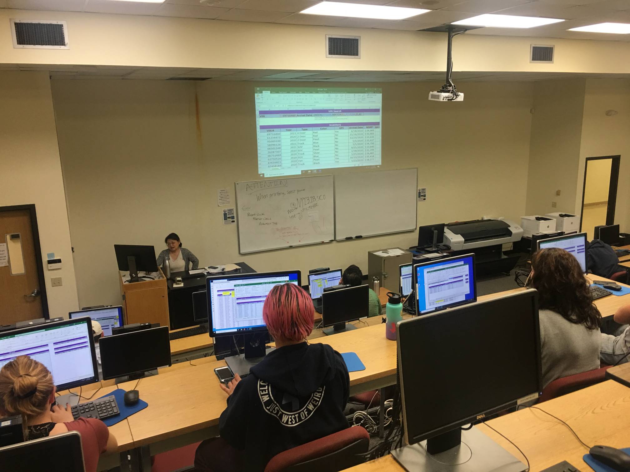 students doing statistics on computers in a lecture hall