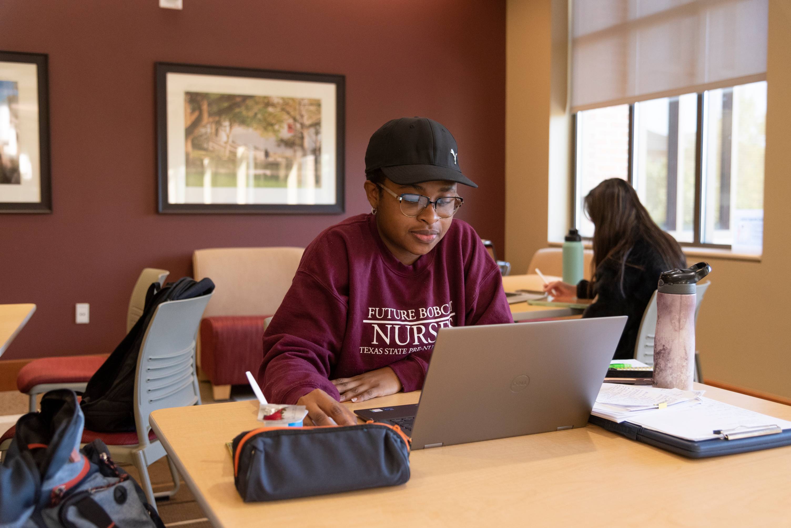 nursing student studying on laptop