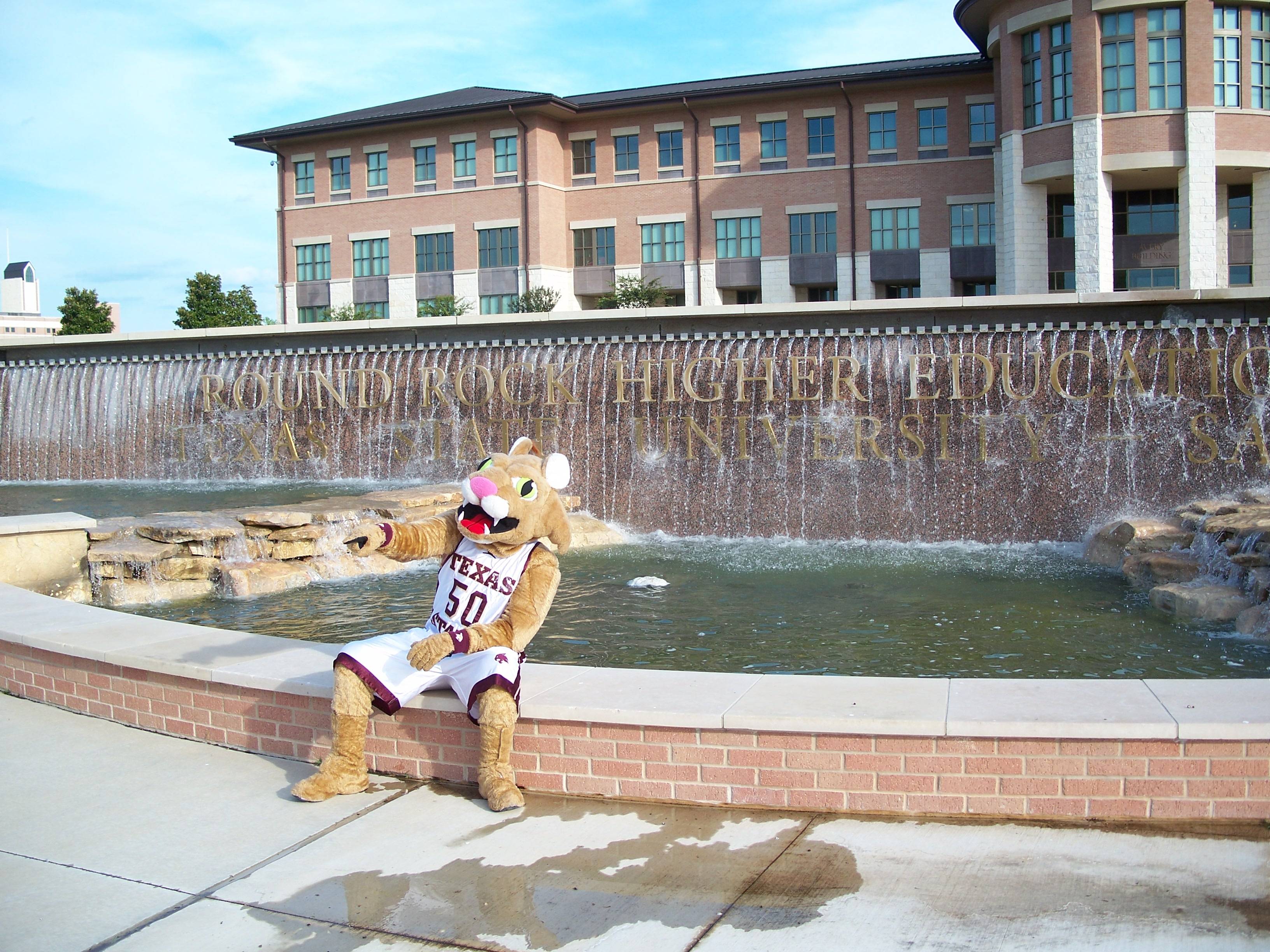 boko the bobcat in front of the avery building