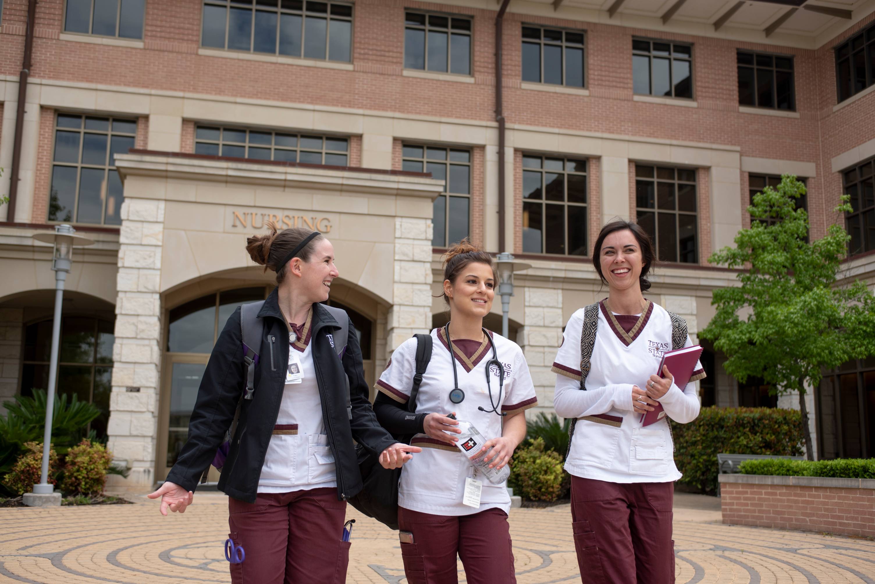 3 students walking and talking
