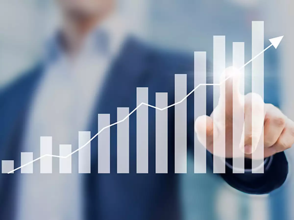 Man pointing to chart that shows progress