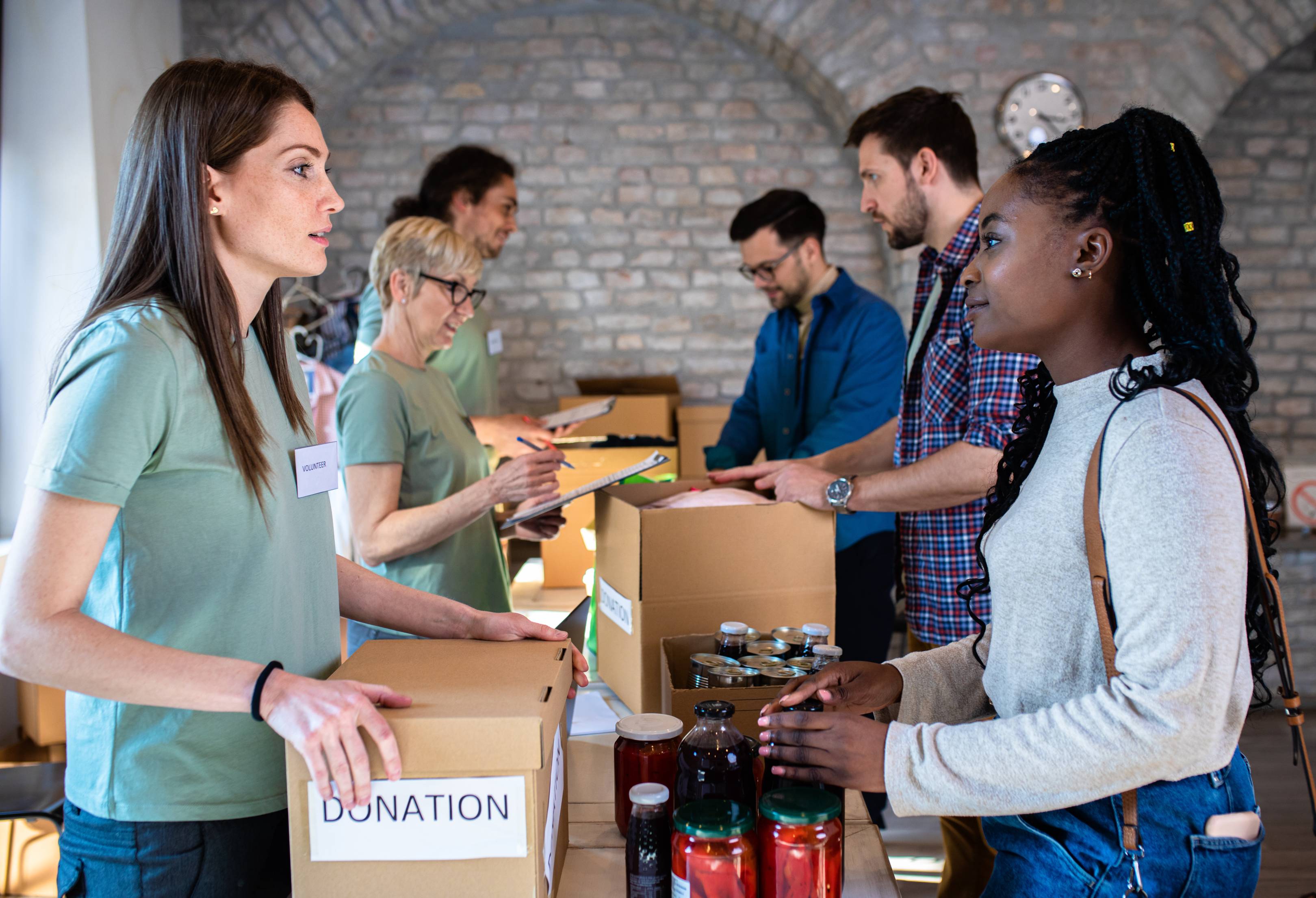 Group of individuals working in food bank.