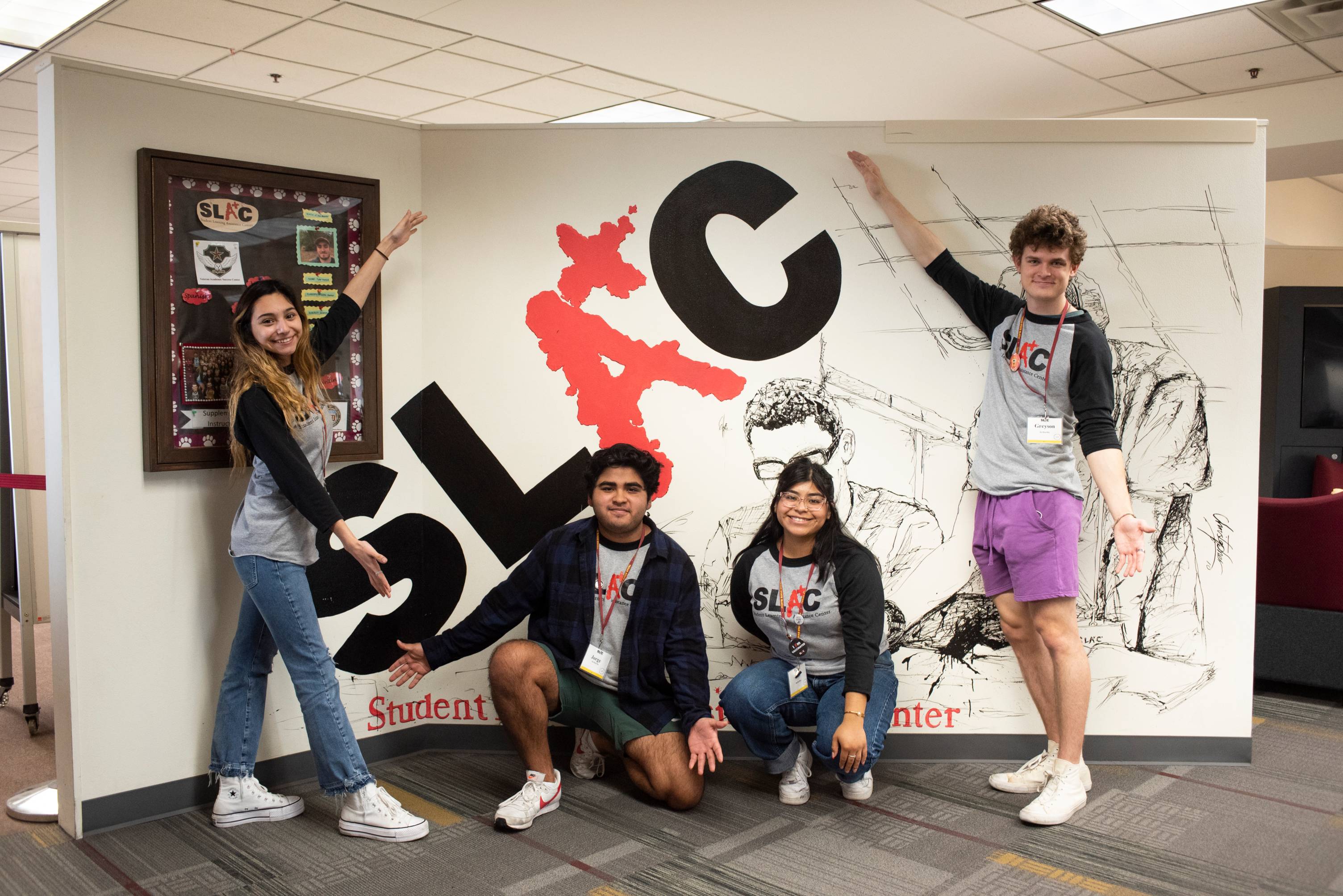 students in front of SLAC mural