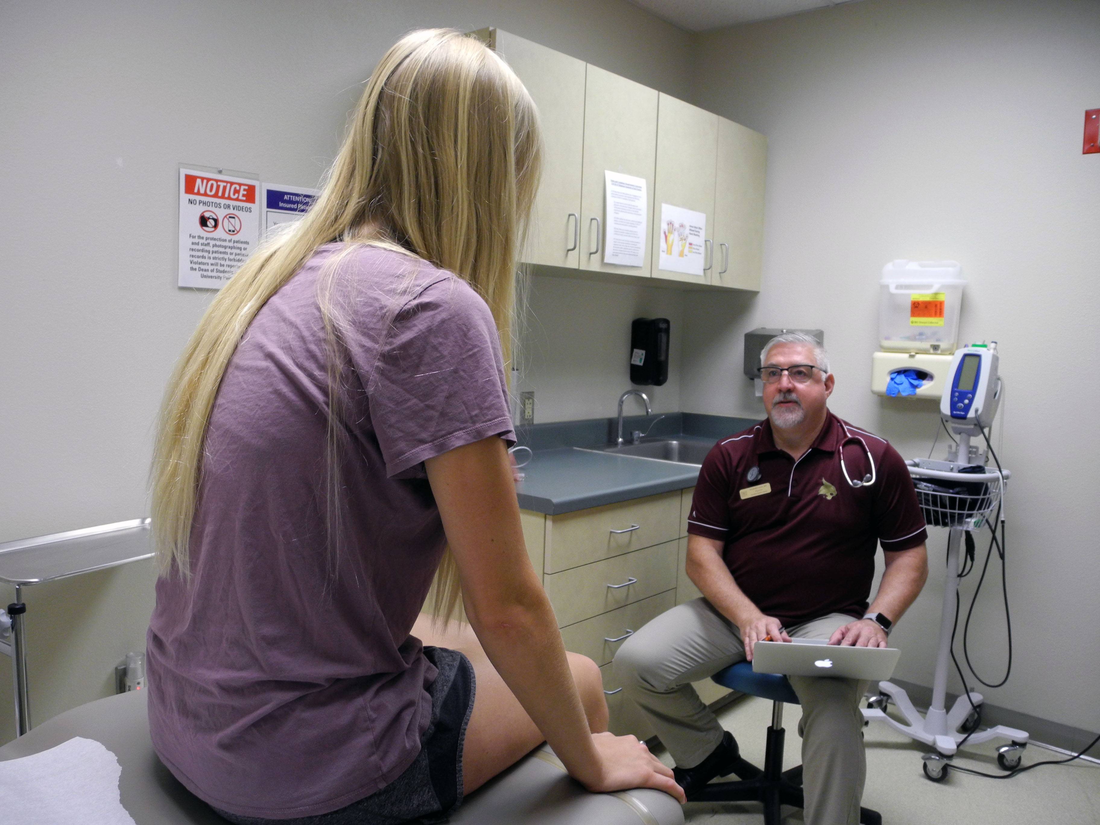 provider giving a student an exam