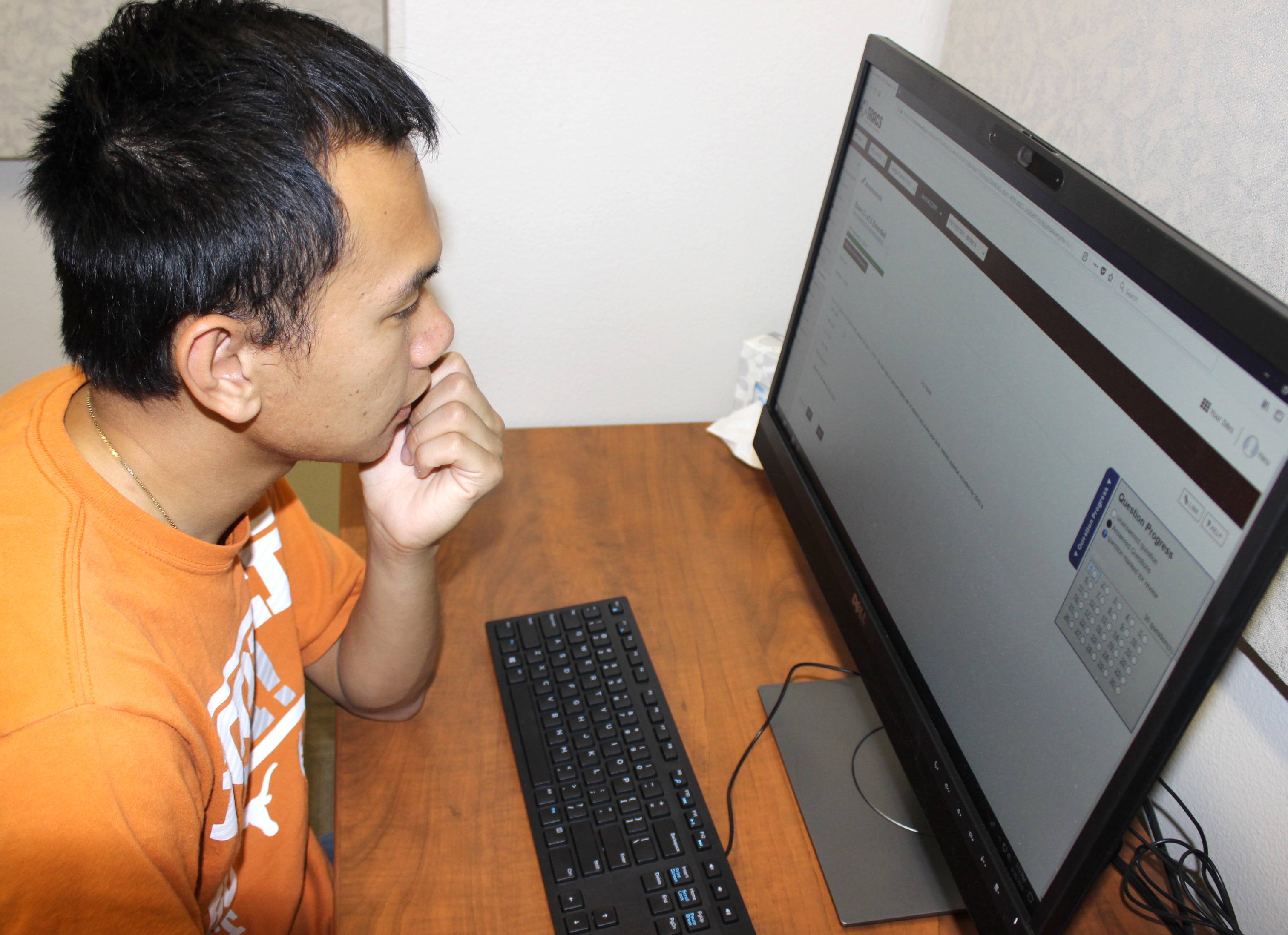 a student sitting in front of computer