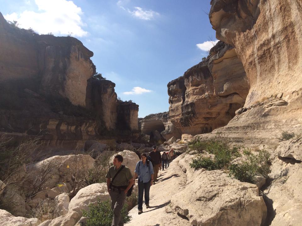 Site tour with lower pecos canyonlands in backdrop