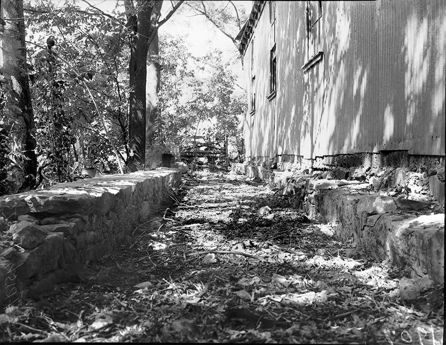 black and white photography of a section of the acequia madre in 1938 behind the Irish flats area of San Antonio