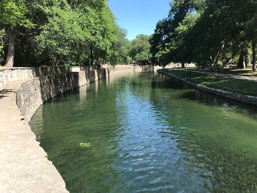 san antonio river lined with stone walls