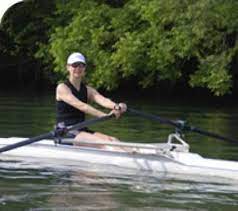 Dr. Elizabeth Skerpan Wheeler kayaking across the river 