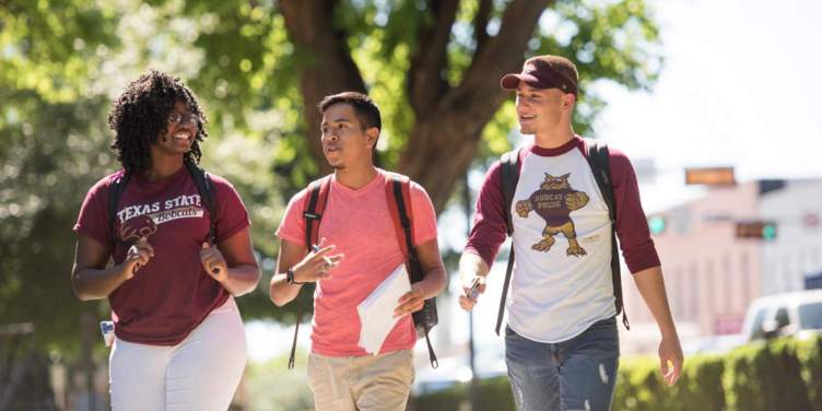 undergraduates walking through campus