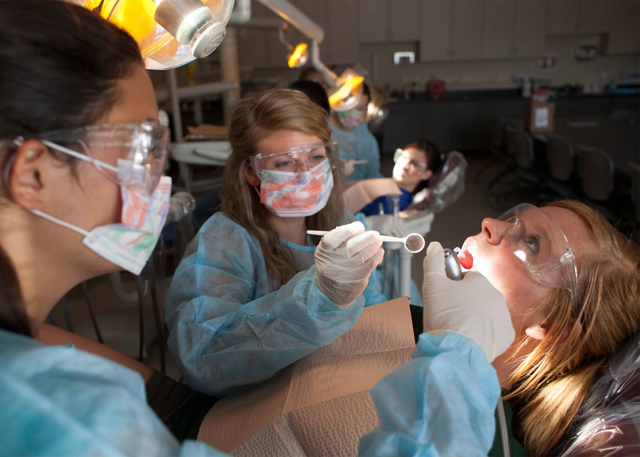 dental students working on patients