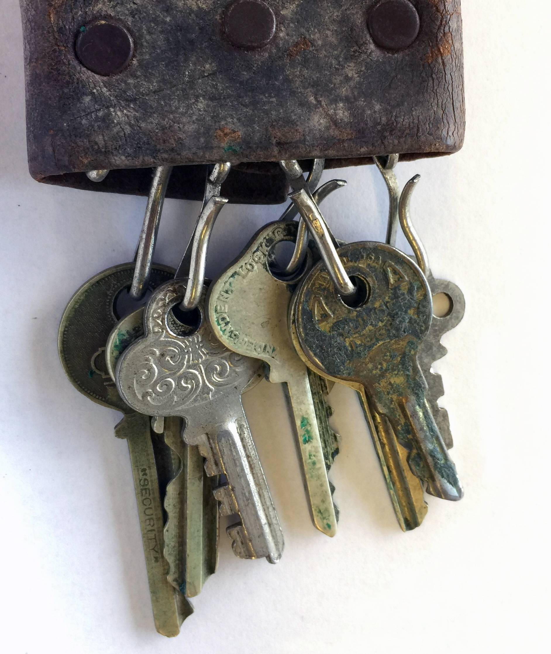 Photograph of President Evans' keys held in a leather key wallet