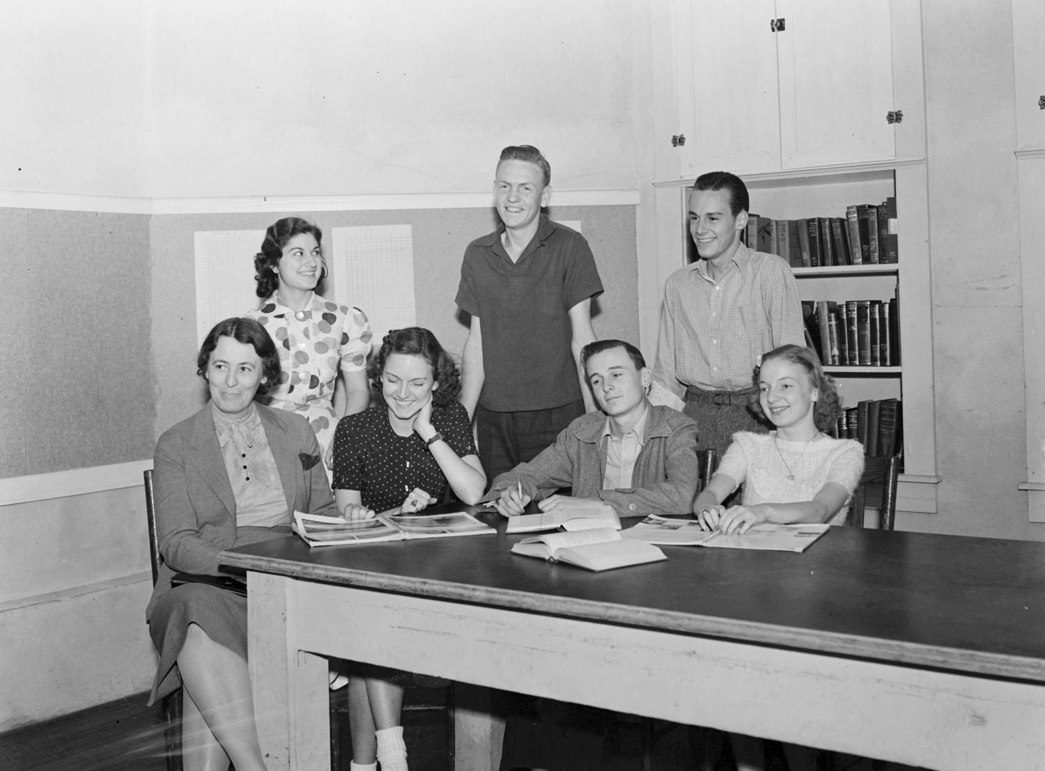 Photograph of seven people at a table