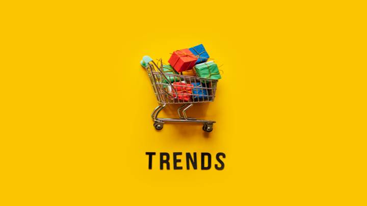 Picture of a shopping cart with packages sitting above the word, "Trends."
