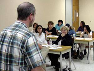 Dave Henton, LMSW-ACP, instructs graduate students in the joint master of social work degree program between Southwest Texas State University and the University of Houston-Victoria.