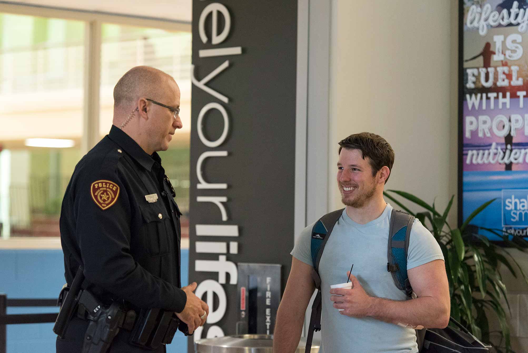 UPD Officer talking with a student