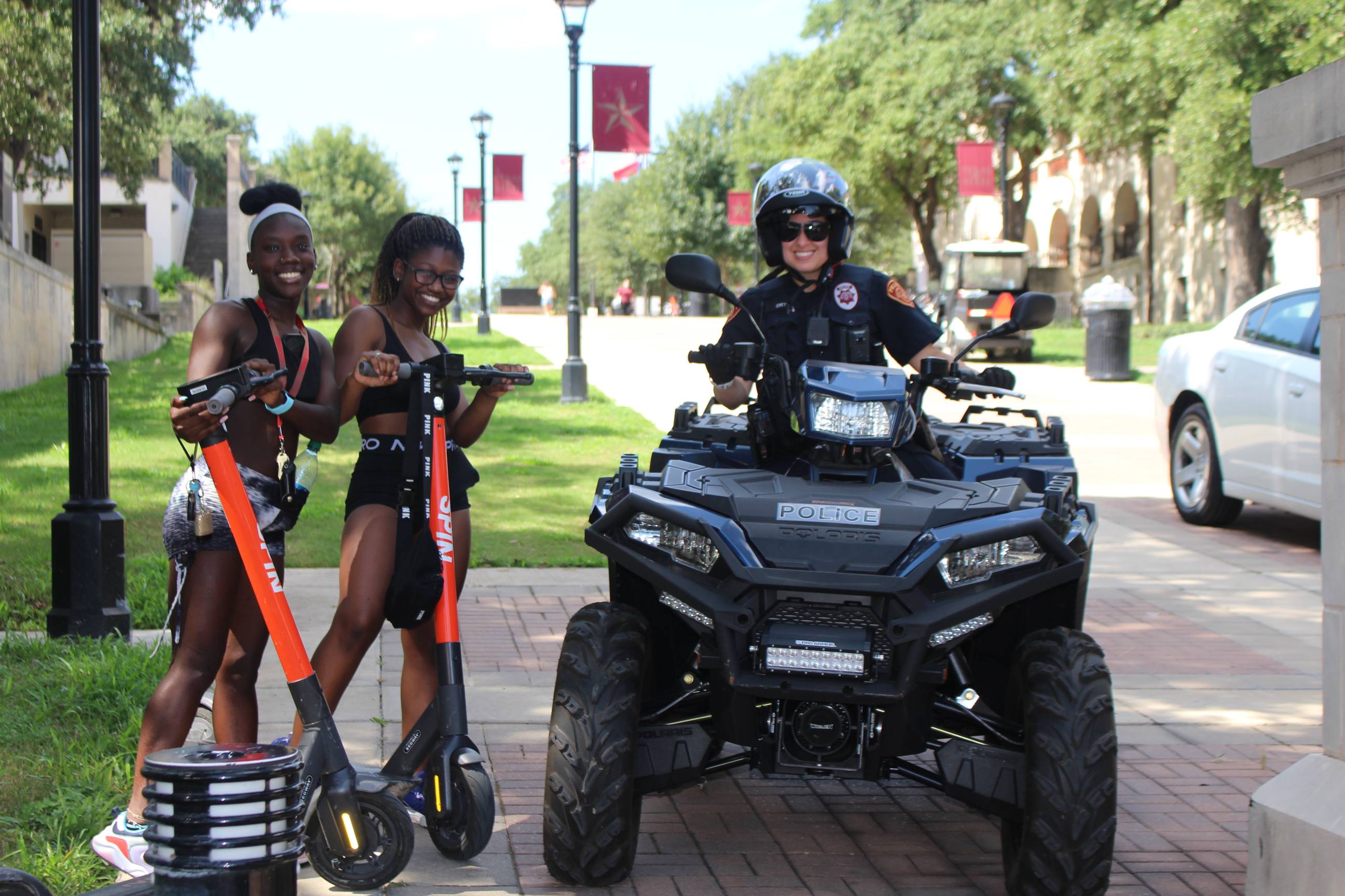 Girls on Scooters with Officer on ATV