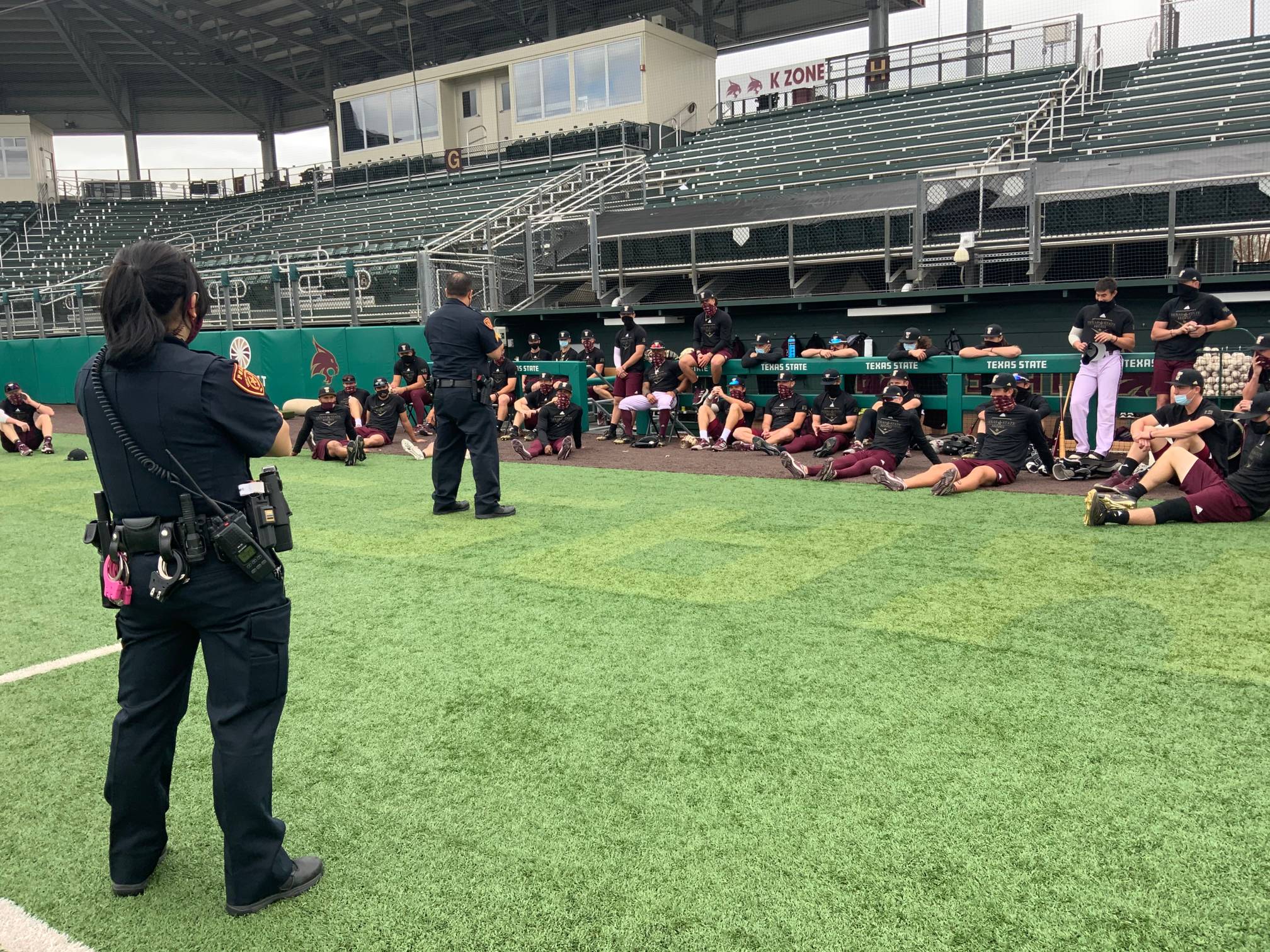 UPD officers talking to student athletes