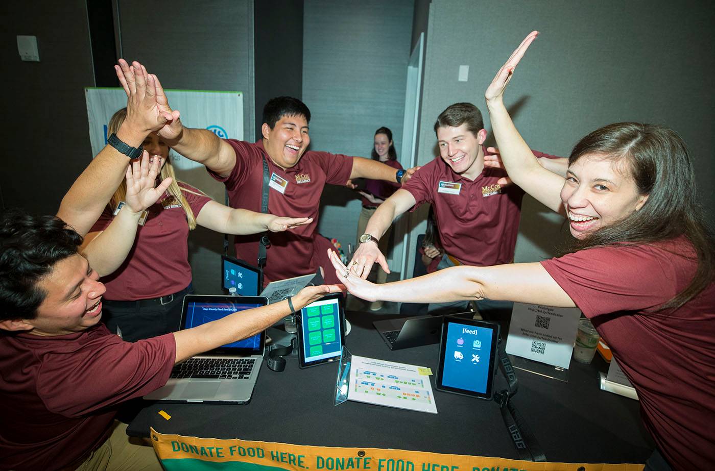 Five students celebrate a win at innovation reception