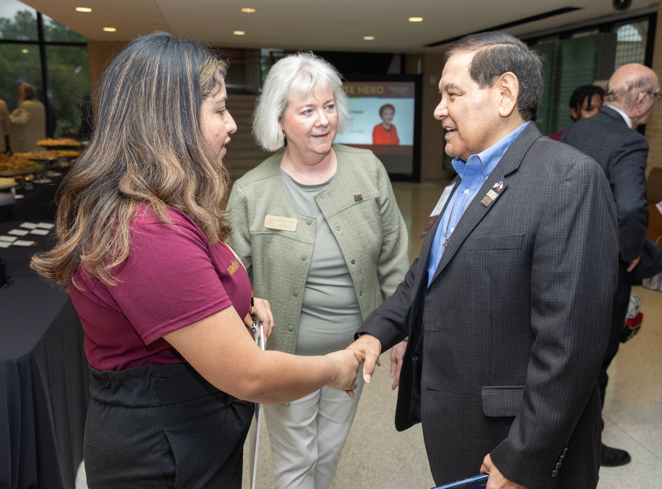 student meets donor at reception