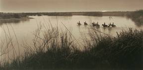 Photograph: Crossing the Rio Grande, © 1988, by Bill Wittliff