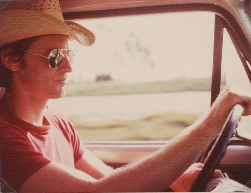 Man in sunglasses driving