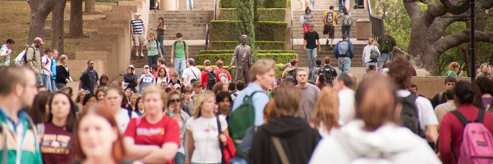 A Crowd of students in front of the LBJ statue
