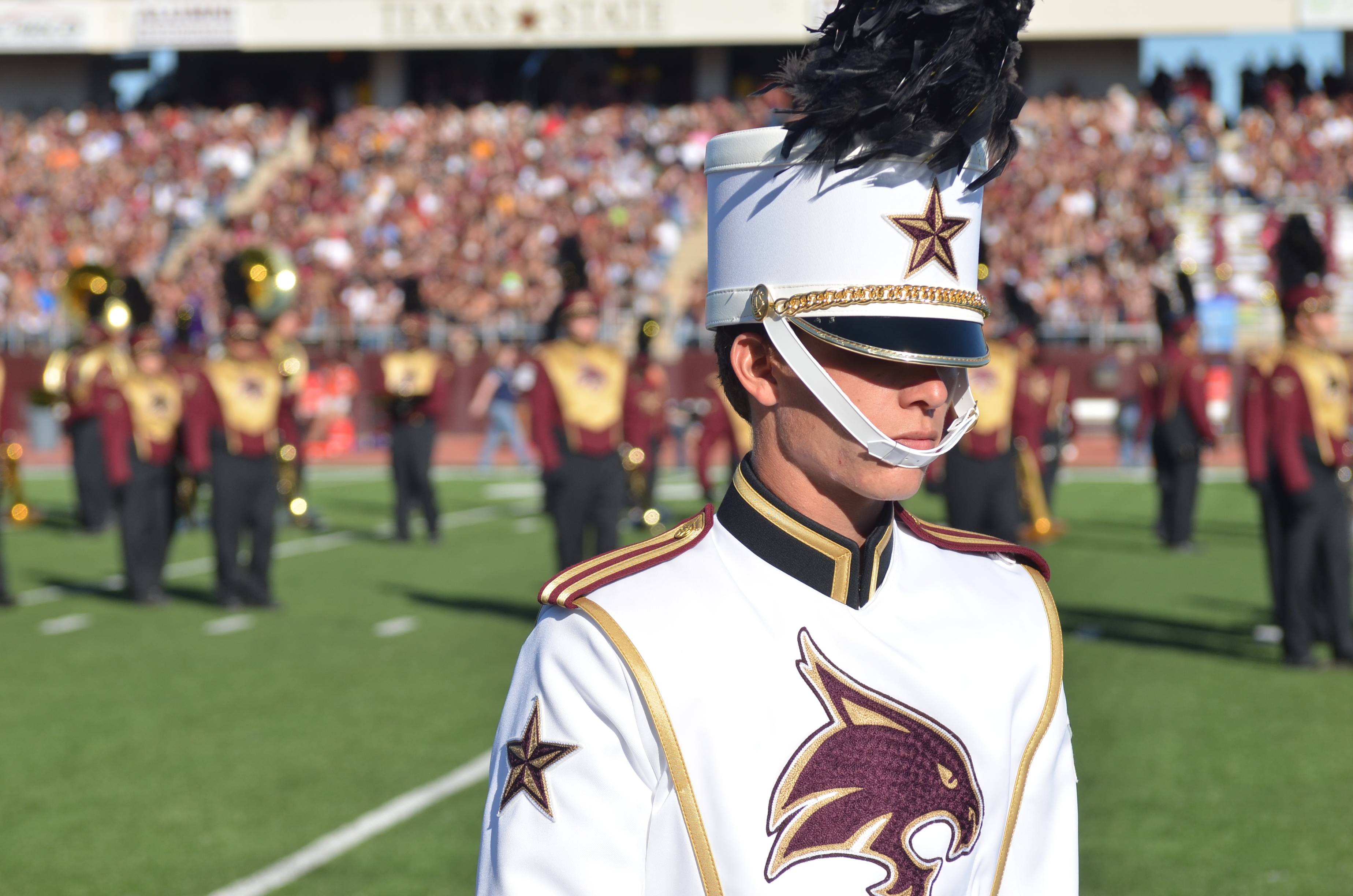 Image of a trumpet player on the field performing