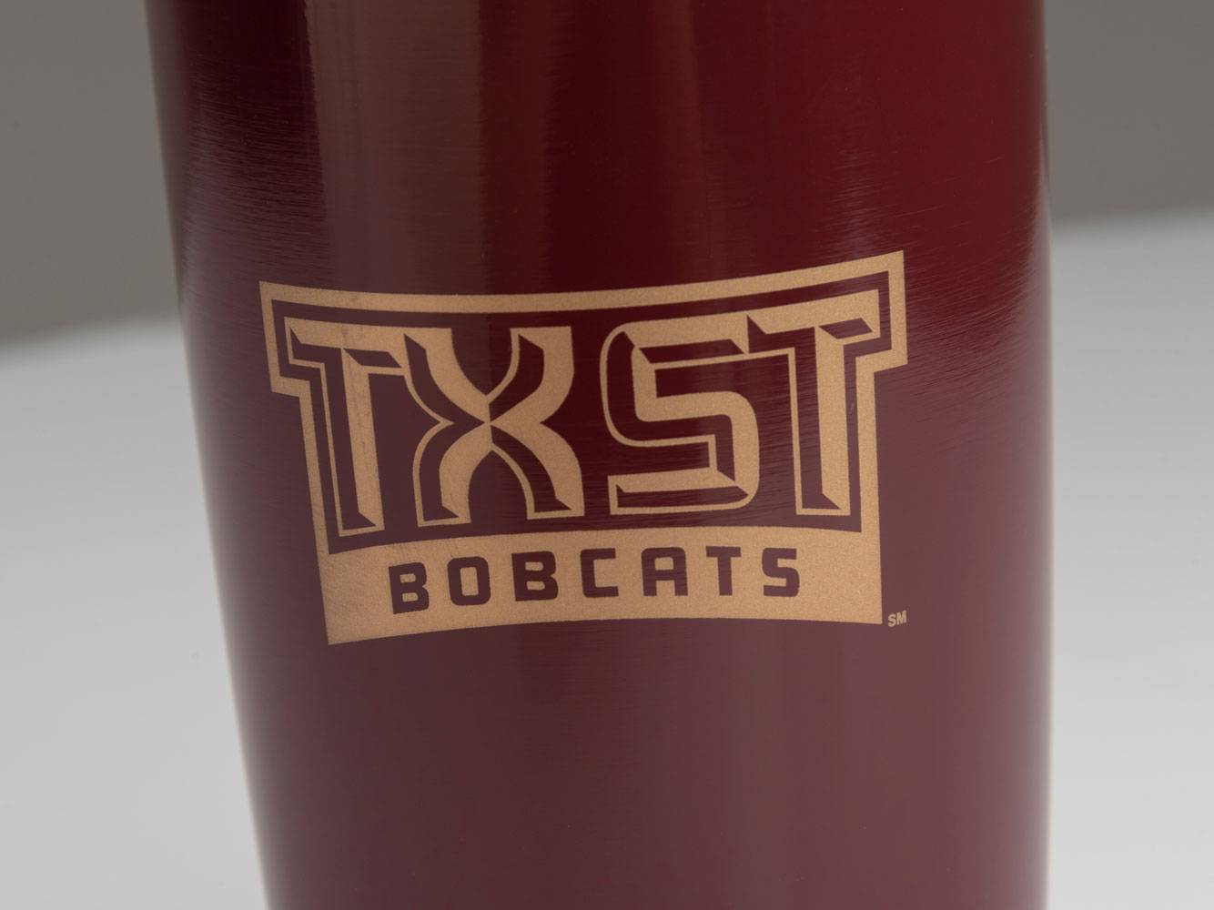 TXST Bobcats logo on a maroon mug