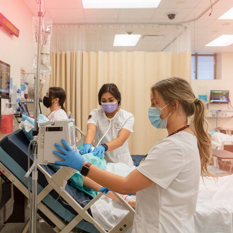 Nursing students practice their skills