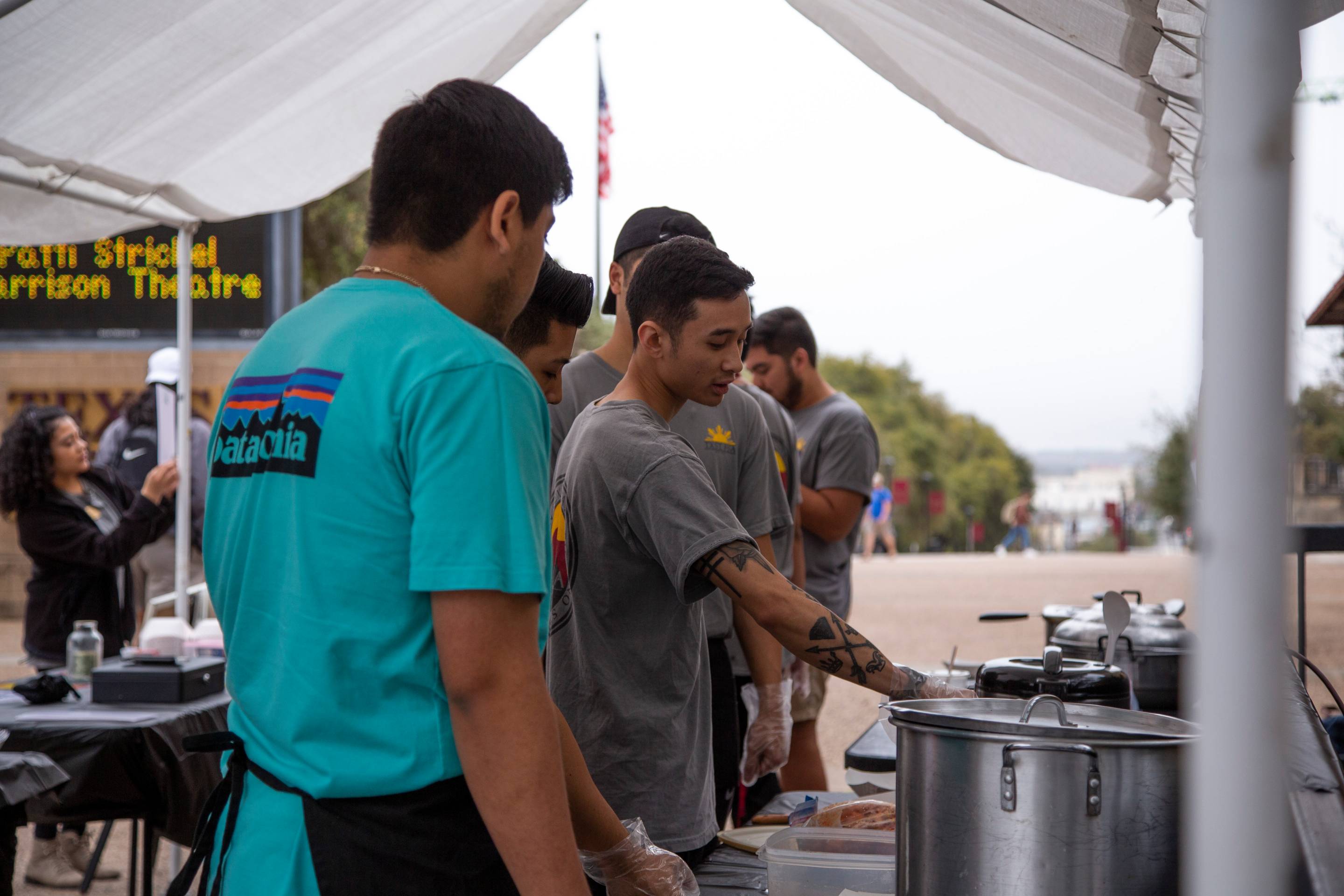 Students on the quad with pots and pans