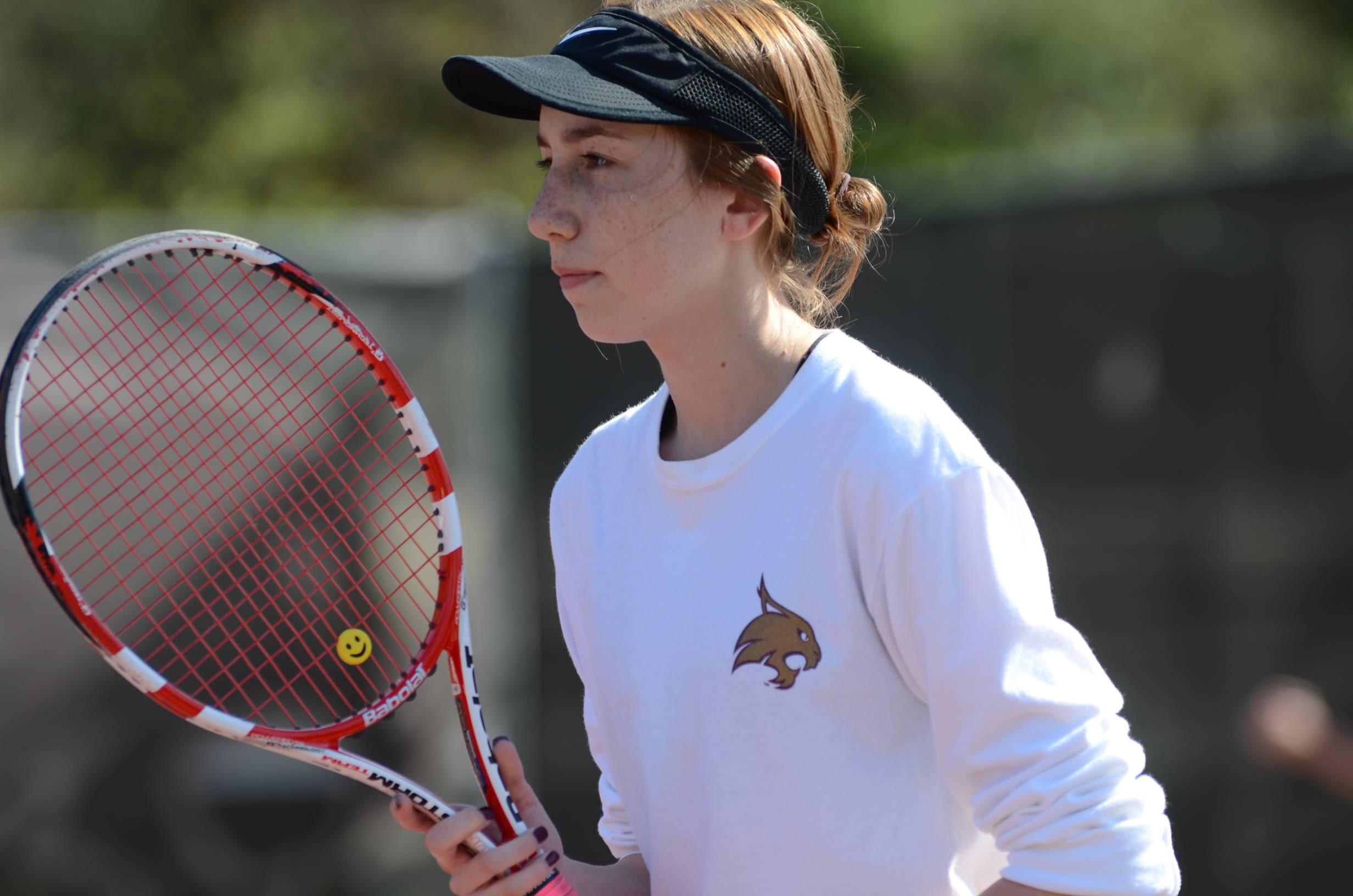 A girl playing tennis