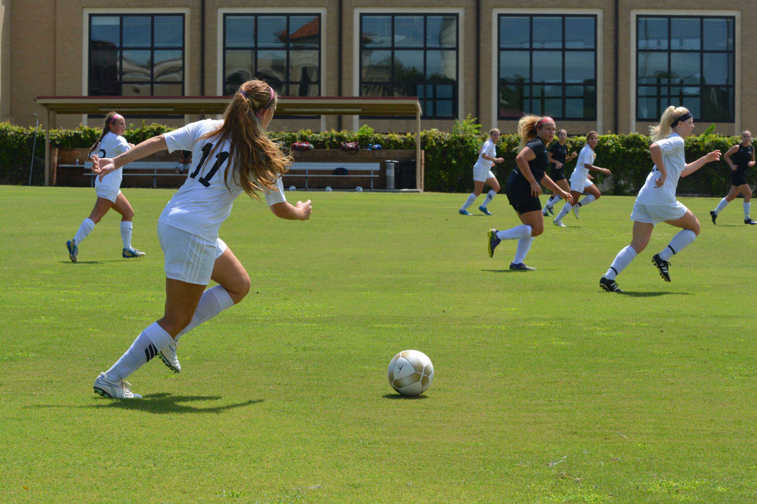 Women's Soccer player playing the ball