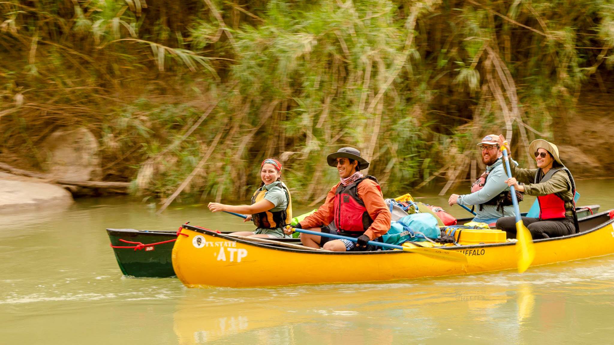 Students Canoeing on a River