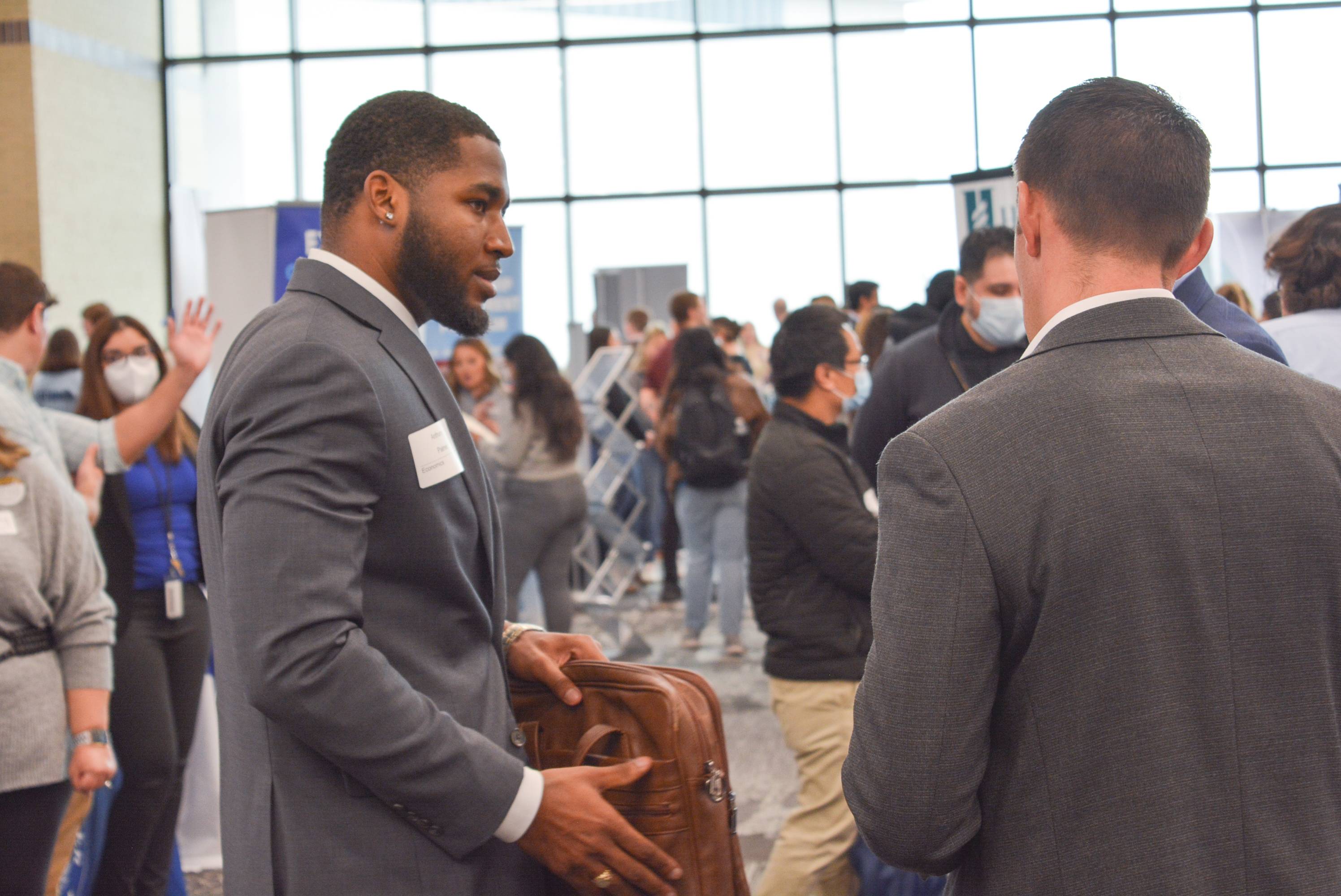Student approaching a recruiter at a Texas State career fair